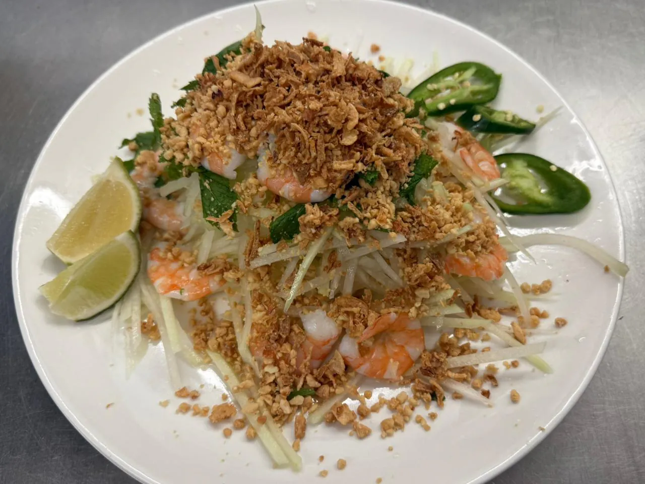 Green Papaya Salad w Prawn Fresh papaya salad with prawns and crispy garlic at An Chi, a Vietnamese restaurant in San Francisco