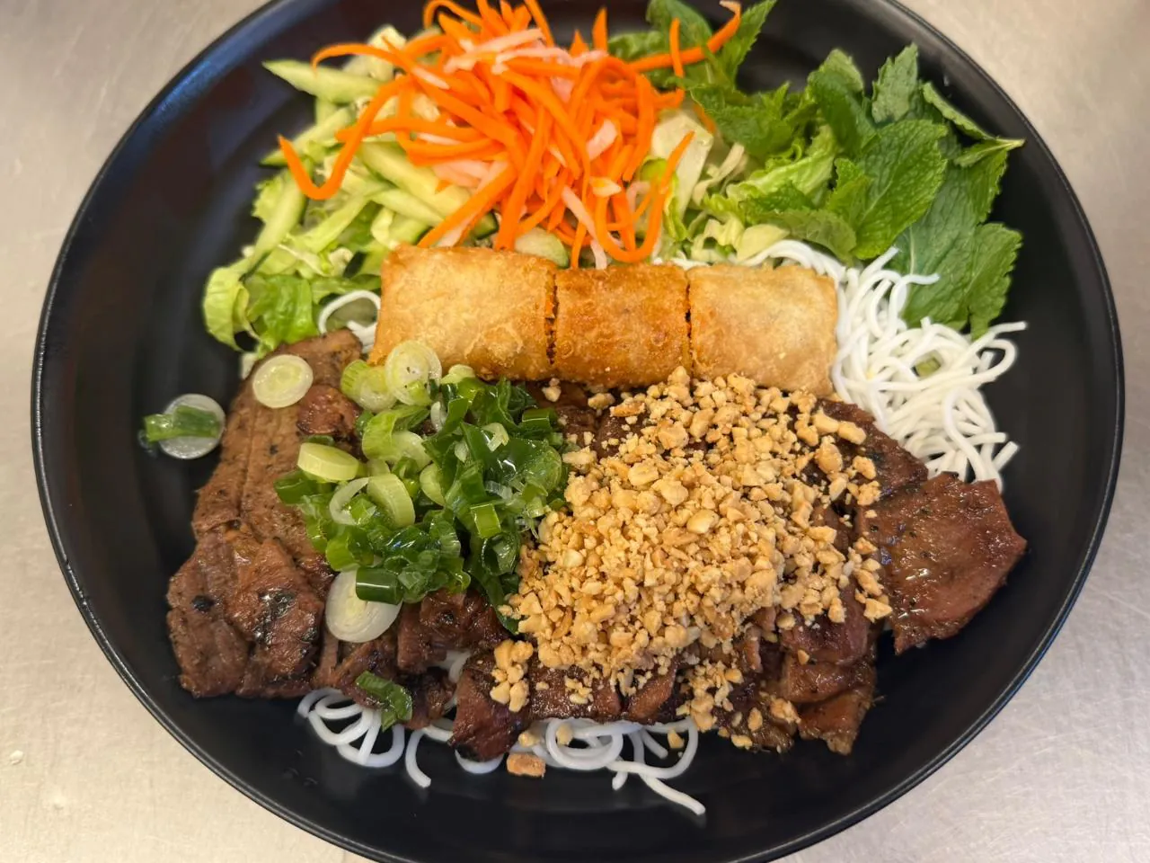 Pork Imperial Roll w Vermicelli Vermicelli bowl with pork rolls and veggies at An Chi, a Vietnamese restaurant in San Francisco