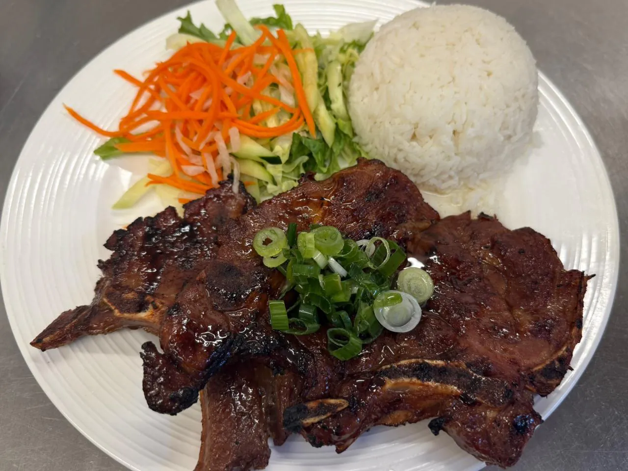 Rice w Grilled ribs over rice with veggie salad at An Chi, a Vietnamese restaurant in San Francisco